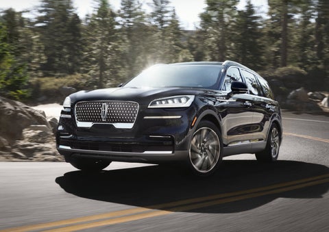 A Lincoln Aviator® SUV is being driven on a winding mountain road | Kindle Lincoln in Cape May Court House NJ