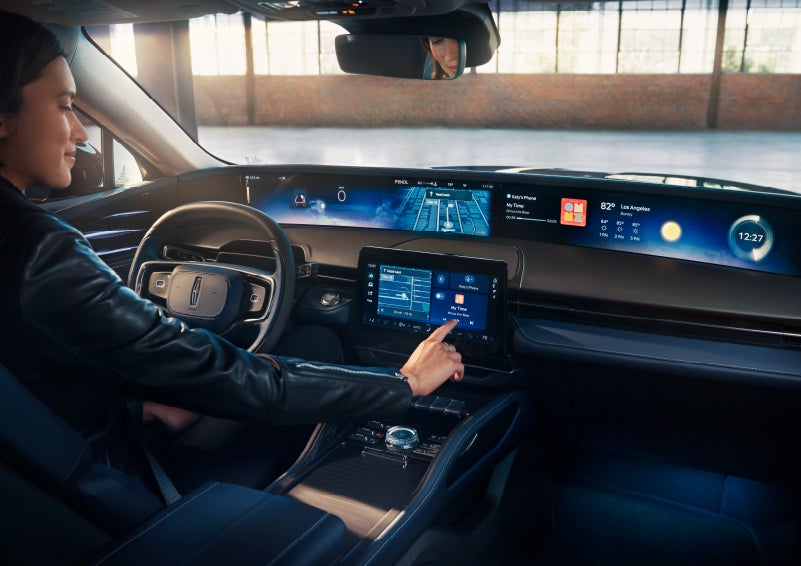 The driver of a 2024 Lincoln Nautilus® SUV interacts with the center touchscreen. | Kindle Lincoln in Cape May Court House NJ