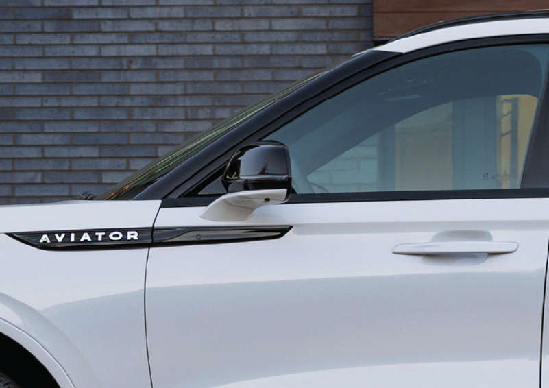The driver’s door of a white 2025 Lincoln Aviator® SUV is showcased. | Kindle Lincoln in Cape May Court House NJ