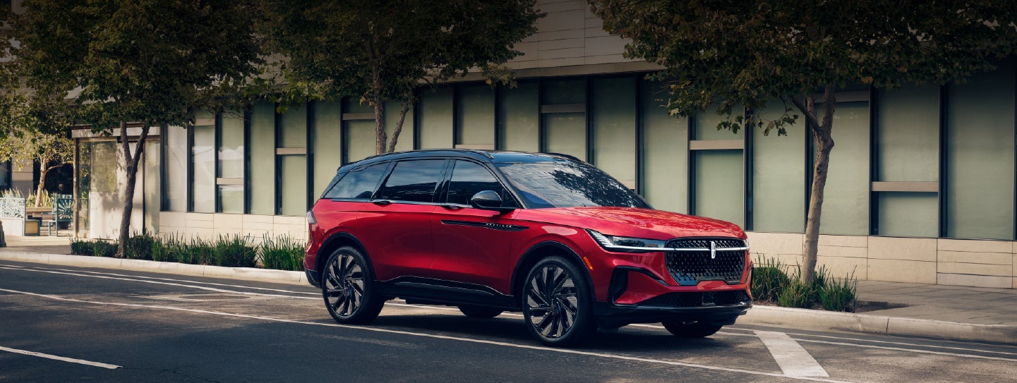 A 2025 Lincoln Nautilus® SUV with an available hybrid powertrain is parked in an urban setting. | Kindle Lincoln in Cape May Court House NJ