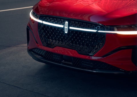 The available front LED light bar and center Lincoln Star logo glow at dusk. | Kindle Lincoln in Cape May Court House NJ