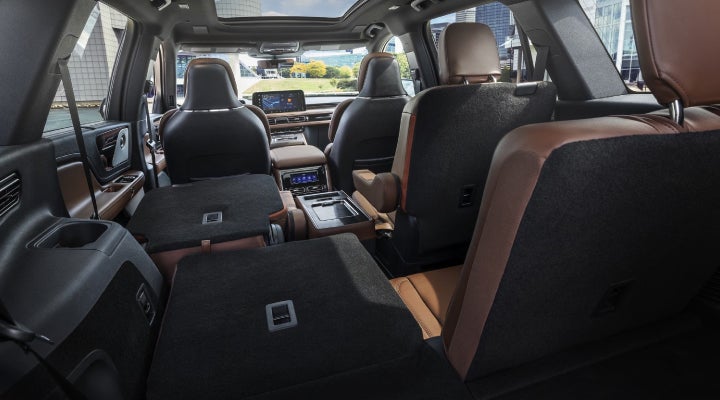 One side of the PowerFold® third-row seat and a second-row seat are folded forward in the 2026 Lincoln Aviator® SUV. | Kindle Lincoln in Cape May Court House NJ