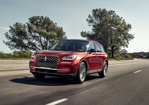 A 2026 Lincoln Corsair® SUV is shown being driven on a country road. | Kindle Lincoln in Cape May Court House NJ