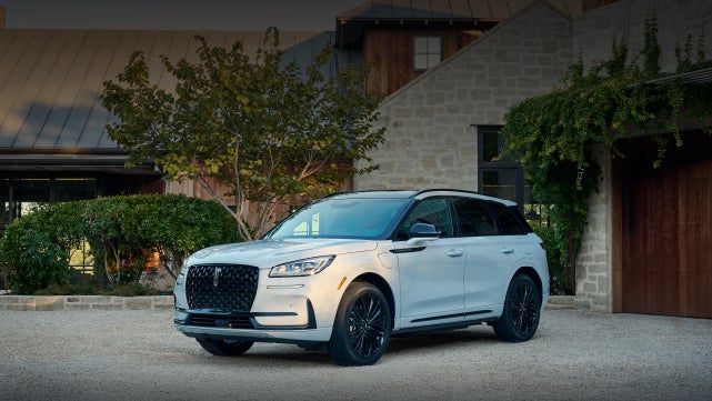 A 2026 Lincoln Corsair® SUV is parked in front off a luxury home. | Kindle Lincoln in Cape May Court House NJ