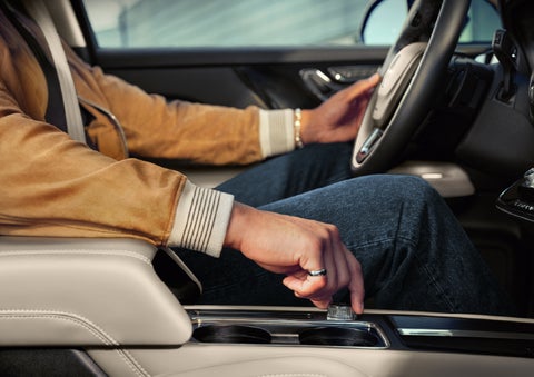 The driver of a 2026 Lincoln Corsair® SUV is shown selecting a drive mode. | Kindle Lincoln in Cape May Court House NJ