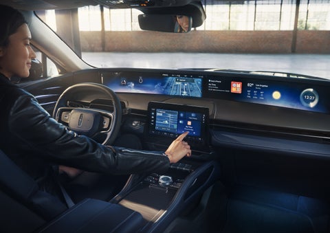 The driver of a 2026 Lincoln Nautilus® SUV interacts with the center touchscreen. | Kindle Lincoln in Cape May Court House NJ